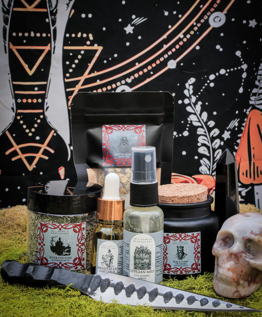 Hades Ritual Kit including soy candle, bath salts, ritual oil, and cleansing spray for underworld deity devotion and shadow exploration.