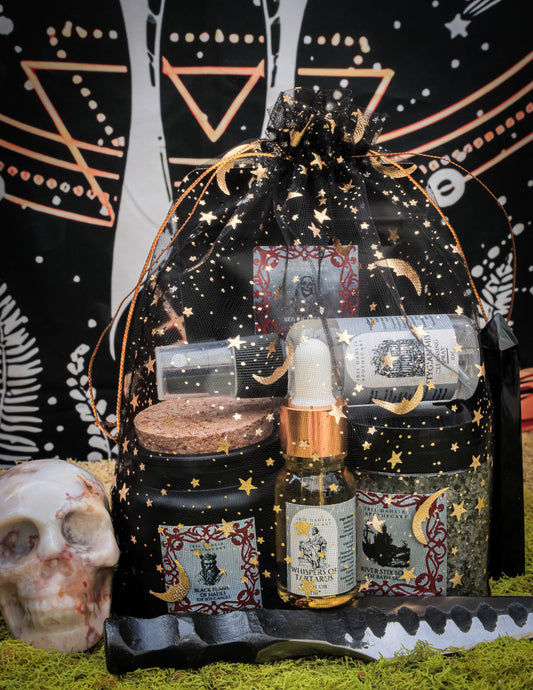Hades Ritual Kit including soy candle, bath salts, ritual oil, and cleansing spray for underworld deity devotion and shadow exploration.