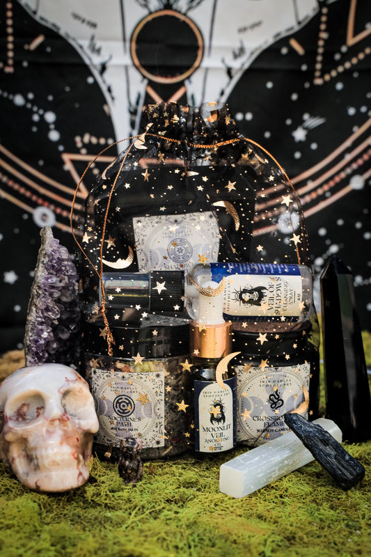 Hecate Ritual Set featuring soy candle, bath salts, ritual oil, and cleansing spray for shadow work and moon magic.
