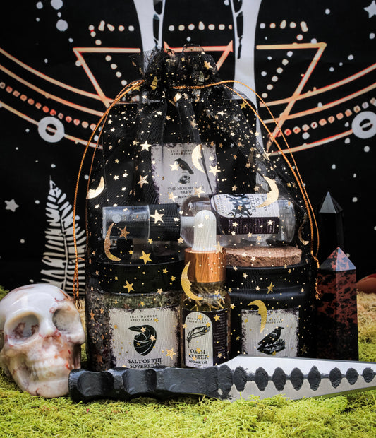 The Morrigan Ritual Kit comprising soy candle, bath tea, ritual oil, and cleansing spray for sovereignty and transformation rituals