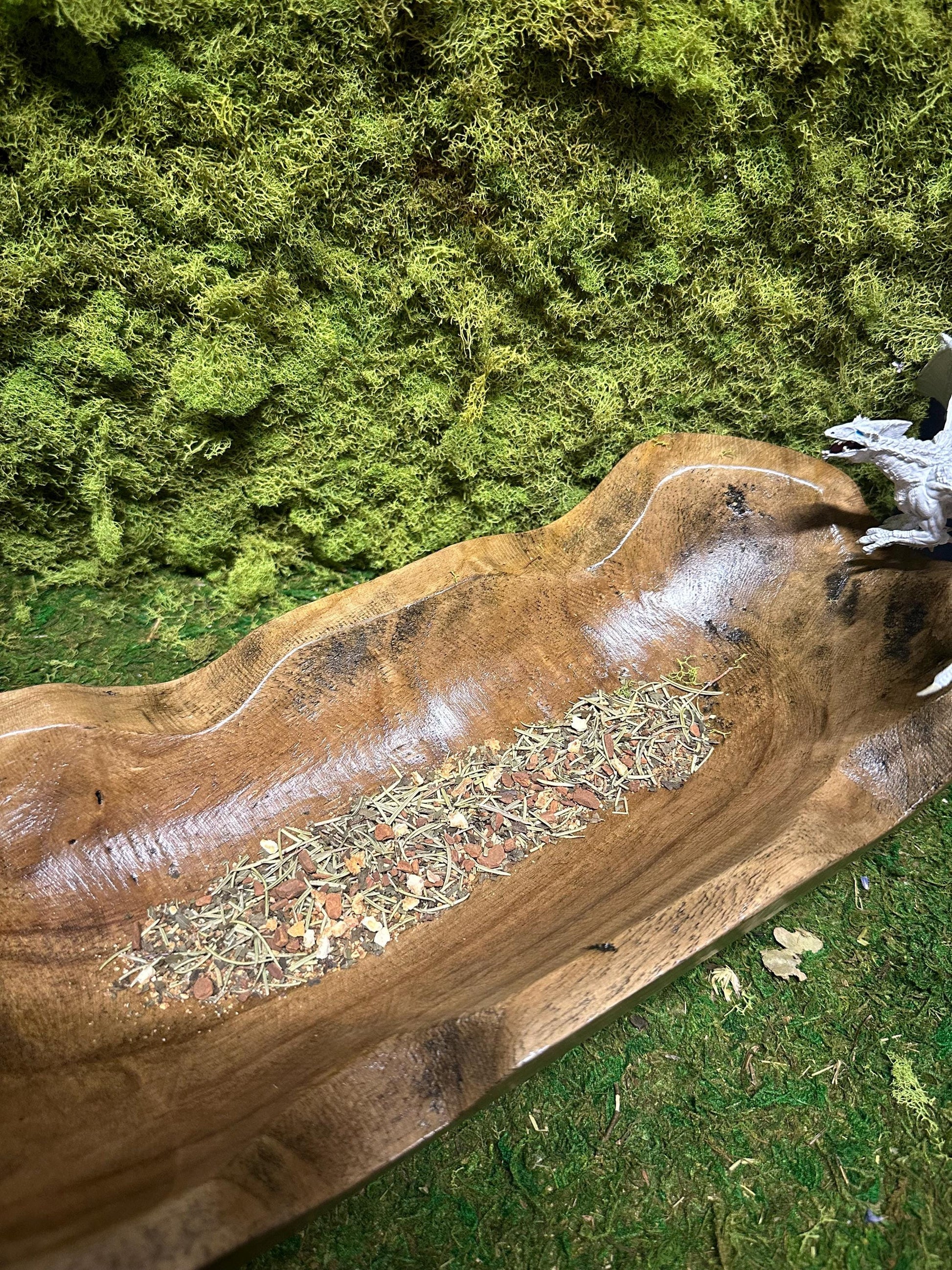 Dragon’s Breath Facial Steam elegantly presented in a rustic wooden oblong bowl.